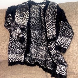 Black and white, thick fuzzy cardigan sweater. Great material. Rarely worn
